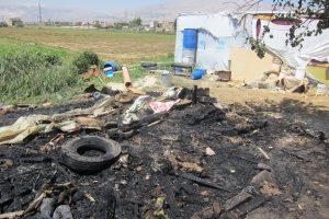 The immediate aftermath of a tent fire in an informal refugee settlement in Zahle, Beqaa Valley, Lebanon