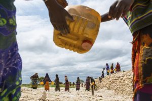 Ethiopian villagers build a well for water supply