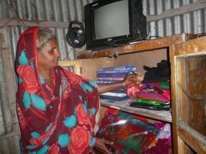 Ramaaza at home with her stock cupboard