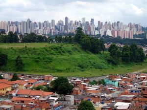 A district in Brazil demonstrates favelas against a backdrop of skyscrapers